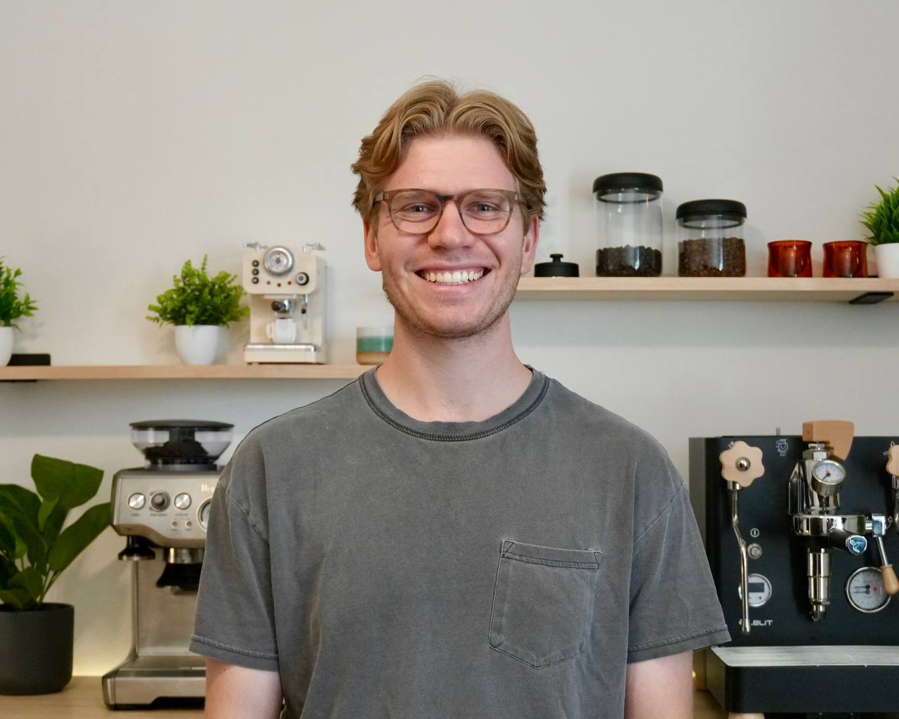 Noah Stern smiling in his coffee studio